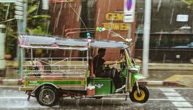 Tuk Tuk under the rain in Bangkok, Thailand